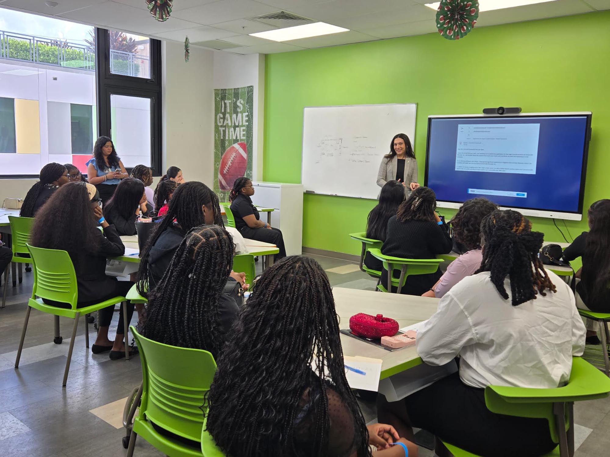 a group of interns attend an orientation in a classroom