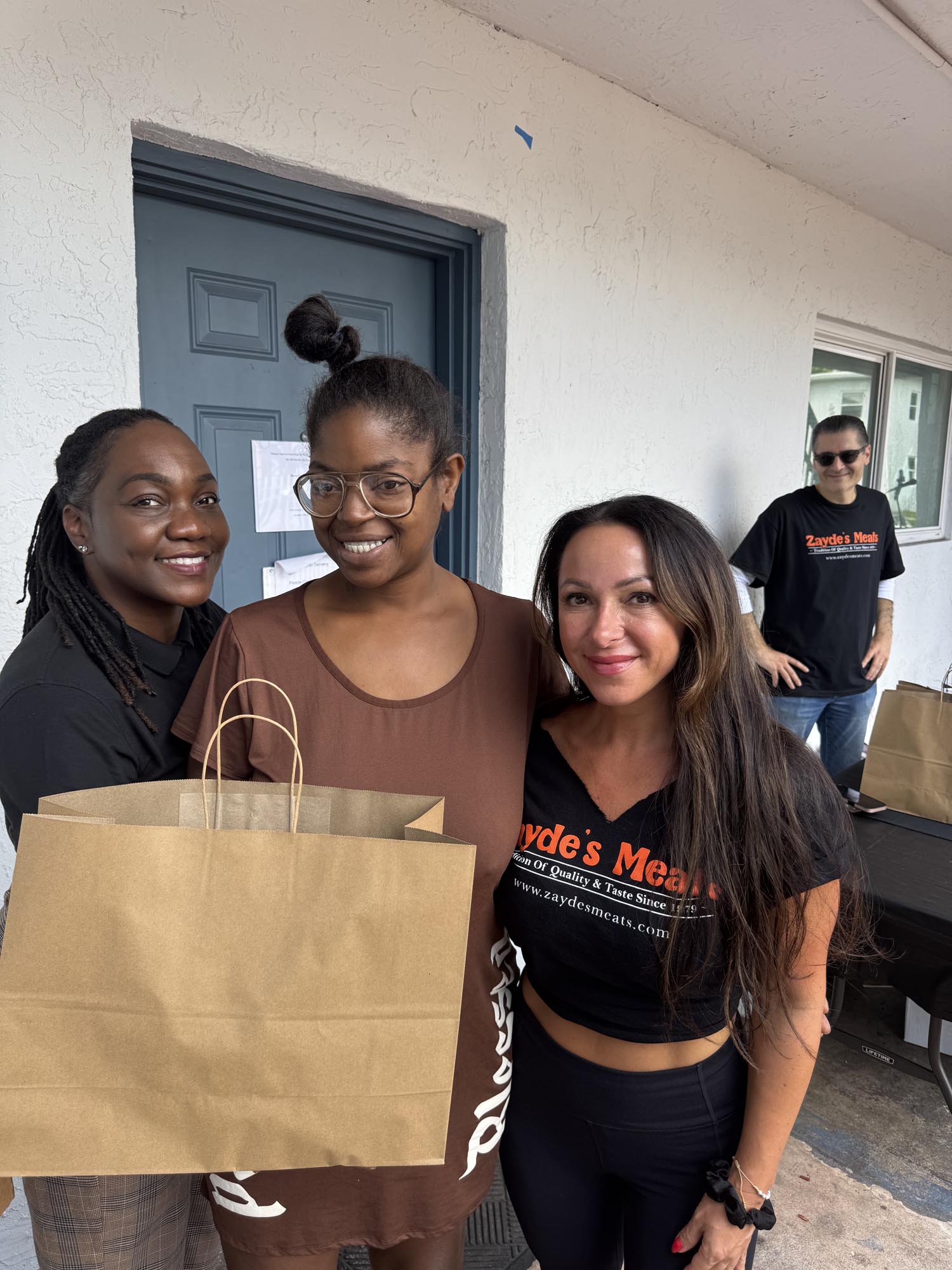 three girls with a shopping bag