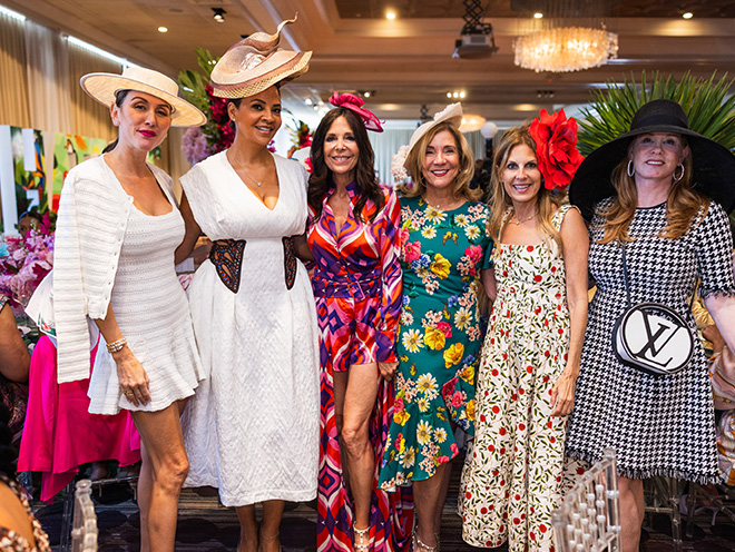 Tracy Wilson Mourning and 5 other women wearing fancy hats at the 2025 Hats Off Luncheon.
