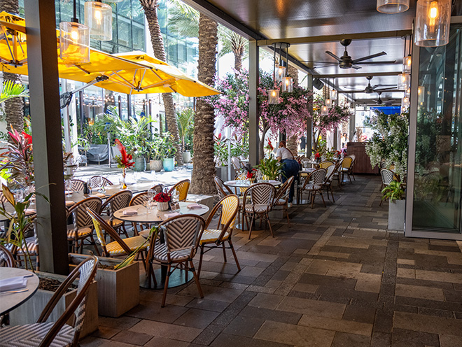 table and chairs along an outdoor side area at Serafina